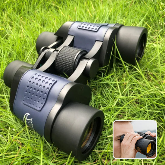 homme observe avec jumelles puissantes